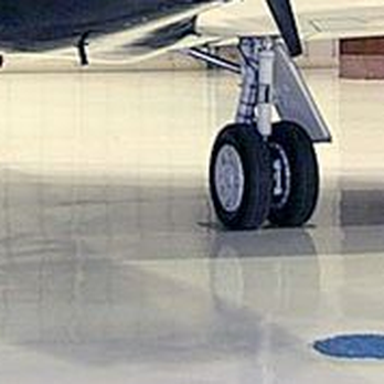 Florock Polymer Flooring - an airplane in a hangar - Flooring Near Me - Chicago, Illinois Florock Polymer Flooring - an airplane in a hangar - Flooring Near Me - Chicago, Illinois