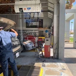 Watching them work while I wait in the air conditioned lobby.