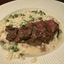 Beef House Grill & Bar - Beef medallions over asparagus risotto.
