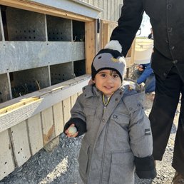 Toddler holding an egg