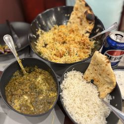 House Of Saffron - Lamb saag, special chicken, rice **Some bites may have been taken before the photo **