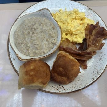 Salt & Ivy, A Coastal Kitchen - This is oatmeal two biscuits, scrambled eggs, and crispy bacon - New American Near Me - Biloxi, Mississippi Salt & Ivy, A Coastal Kitchen - This is oatmeal two biscuits, scrambled eggs, and crispy bacon - New American Near Me - Biloxi, Mississippi