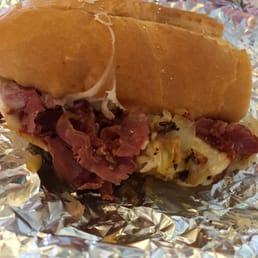 #20 Grilled Pastrami Reuben on white bread. (Half of a regular) #20 Grilled Pastrami Reuben on white bread. (Half of a regular)