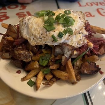 The Dunn Bar - The Irish Brunch Bowl-- filled with fries, homemade corned beef, Guinness cheese sauce, potatoes, and egg. So freaking good! - Irish Pub Near Me - Biddeford, Maine