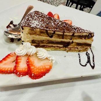 Fava Restaurant & Bar - a piece of cake and strawberries - Mediterranean Near Me - Staten Island, New York Fava Restaurant & Bar - a piece of cake and strawberries - Mediterranean Near Me - Staten Island, New York