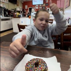 Christy's Donuts - Dylan Ryder gives two thumbs up at Christy's Donuts