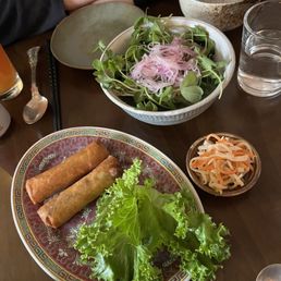 $12 / $6 each spring rolls and a completely tasteless bowl of greens