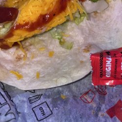 Del Taco - Once I opened my chicken soft taco I found a black curly hair and you can tell this taco had been sitting out for while!