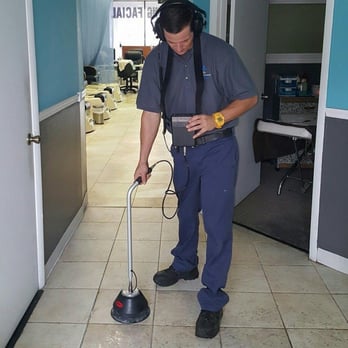 Orlando Leak Detection - a man using a vacuum cleaner - Plumbing Near Me - Orlando, Florida Orlando Leak Detection - a man using a vacuum cleaner - Plumbing Near Me - Orlando, Florida