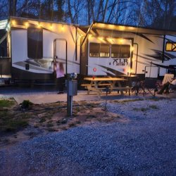 Highlands Riverbend RV Resort and Cabins - Site 16 right next to one of our small parks .