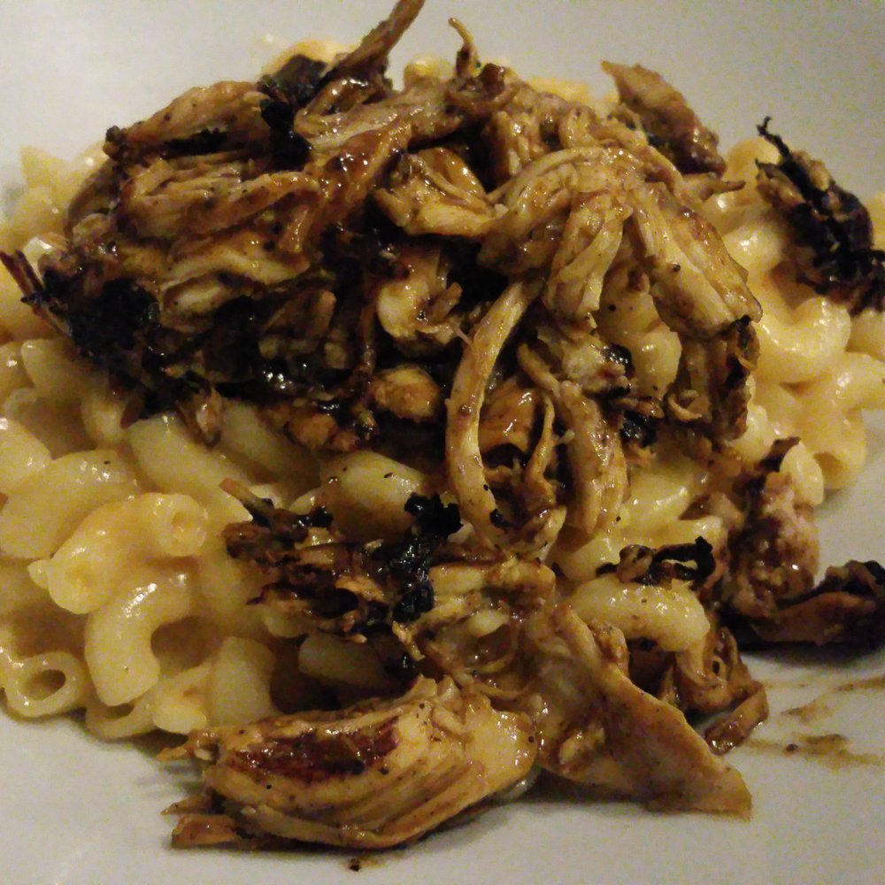 Mac and cheese with spicy crumb topping with jerked chicken