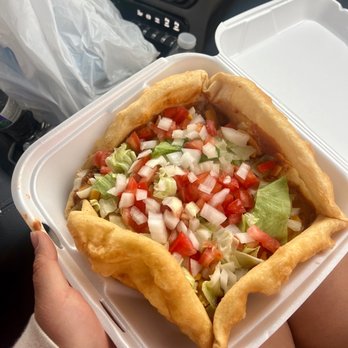 Hwy 89 Yummy Shack - a hand holding a taco in a styrofoam container - Burgers Near Me Hwy 89 Yummy Shack - a hand holding a taco in a styrofoam container - Burgers Near Me