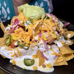 Lowkey Taco - Kitchen Sink Nachos - tortilla chips/pico/guacamole/refried beans/rice/jalapeño/onion/roasted corn/queso/cheddar/sour cream