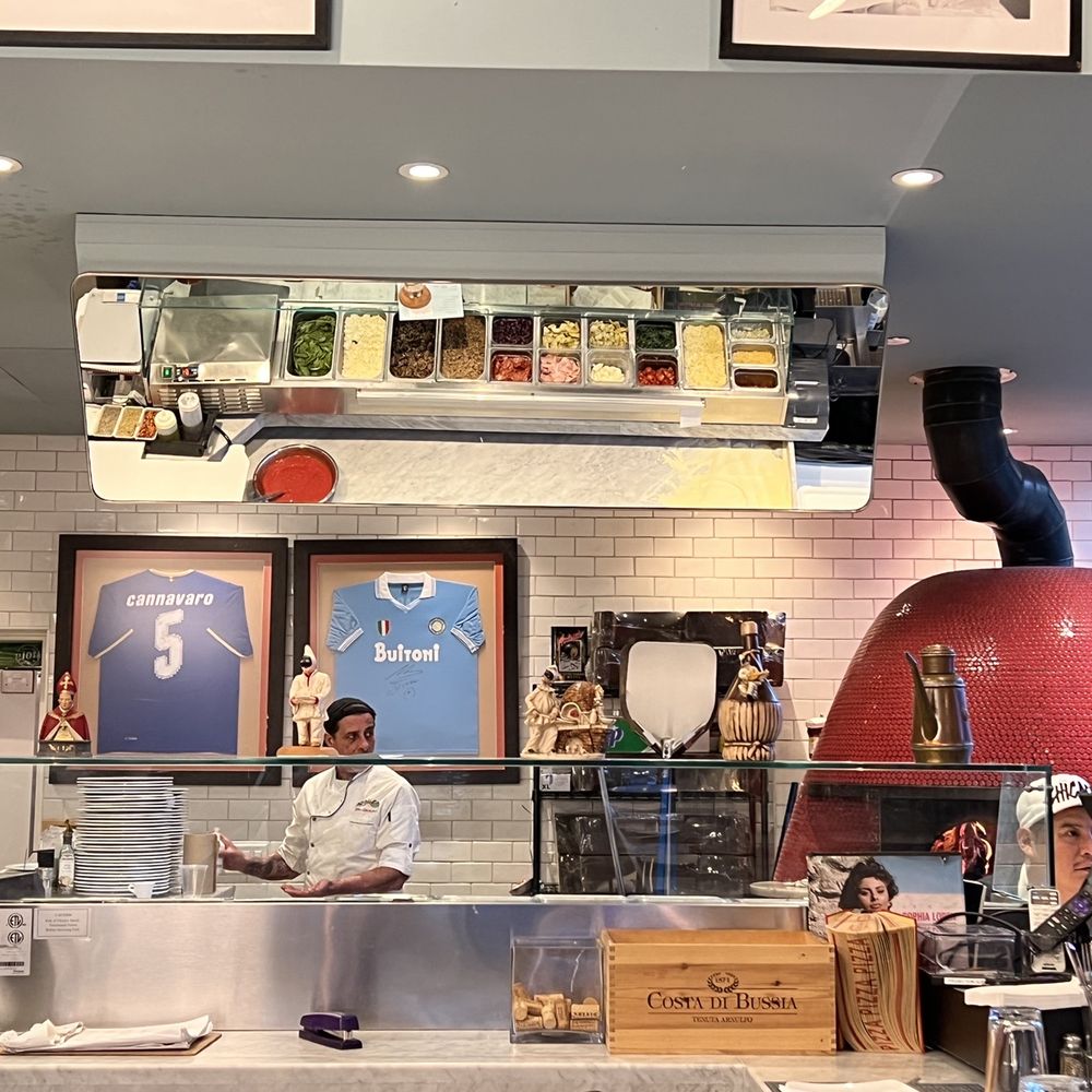 Nella Pizza e Pasta - Pizza making area- mirror above to watch and pizza over to the right - Pizza Near Me - Chicago, Illinois Nella Pizza e Pasta - Pizza making area- mirror above to watch and pizza over to the right - Pizza Near Me - Chicago, Illinois