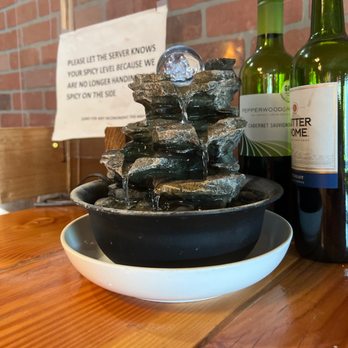 Thai Cottage - a water fountain and bottles of wine - Thai Near Me - Portland, Oregon Thai Cottage - a water fountain and bottles of wine - Thai Near Me - Portland, Oregon