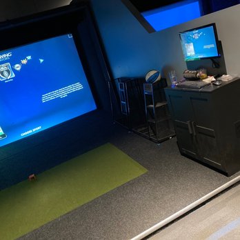 Woody's Press Box - a man playing a video game - American Near Me - Wyoming, Michigan Woody's Press Box - a man playing a video game - American Near Me - Wyoming, Michigan