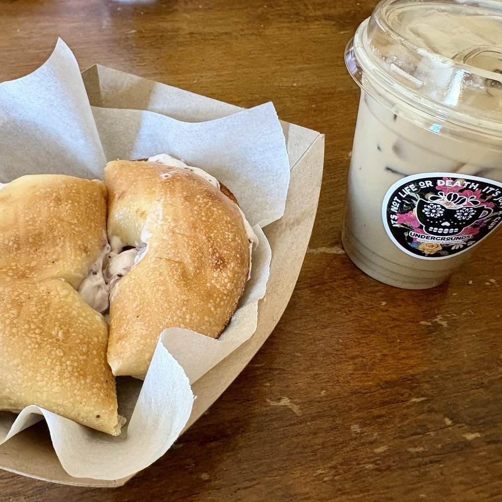 Undergrounds Coffee House and Roastery - Bagel with lemon blueberry cream cheese and a blueberry cobbler iced coffee. - Coffee Roasteries Near Me - Buffalo, New York