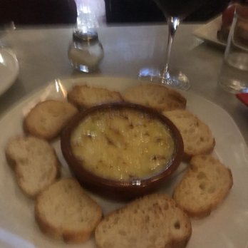 La Tinaja - Bacalau with olive oil and garlic (hot dish).  I highly recommend you get the Rustic Bread which is bread with garlic and tomato. - Tapas Bars Near Me - Barcelona, B