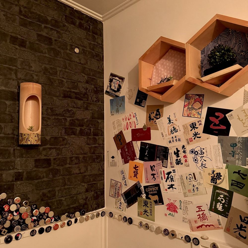 Sake Dining HASHIGO by Zakkushi - Cute bathroom decoration with sake bottle caps and labels - Japanese Near Me - Vancouver, British Columbia Sake Dining HASHIGO by Zakkushi - Cute bathroom decoration with sake bottle caps and labels - Japanese Near Me - Vancouver, British Columbia