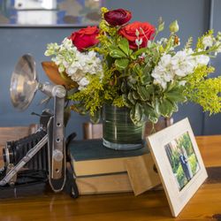 Yesterday's Party - Vintage camera, frames, and books.