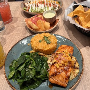 Pecado Mexican - Salmon with mango pico, slice of pineapple, rice and spinach - Mexican Near Me - Bay Shore, New York Pecado Mexican - Salmon with mango pico, slice of pineapple, rice and spinach - Mexican Near Me - Bay Shore, New York