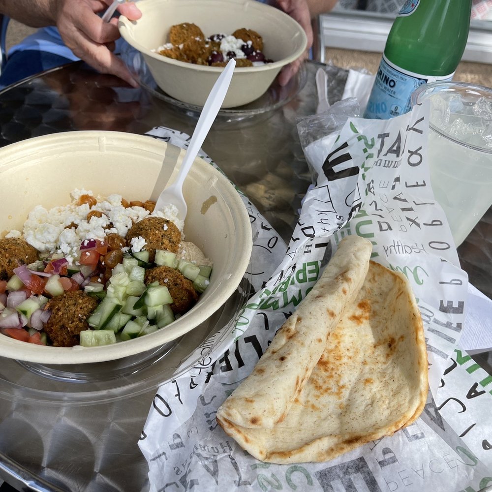 Bowl with pita on the side and lemonade Bowl with pita on the side and lemonade