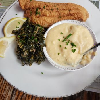 Owens Fish Camp - Cornmeal crusted catfish with spicy collard greens and cheese grits - Seafood Near Me - Sarasota, Florida Owens Fish Camp - Cornmeal crusted catfish with spicy collard greens and cheese grits - Seafood Near Me - Sarasota, Florida
