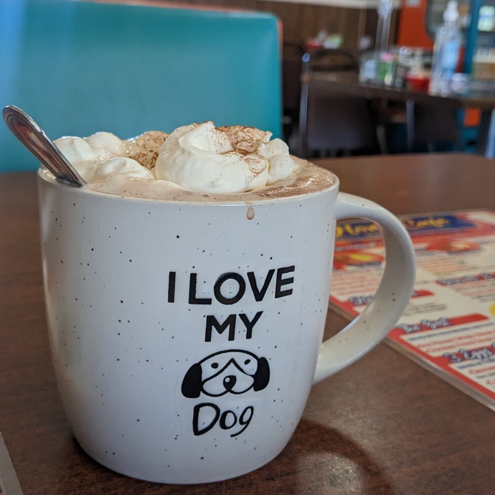 Home Cafe - Hot chocolate in a giant mug, topped with whipped cream. Delicious! - Cafes Near Me - Sheridan, Colorado Home Cafe - Hot chocolate in a giant mug, topped with whipped cream. Delicious! - Cafes Near Me - Sheridan, Colorado