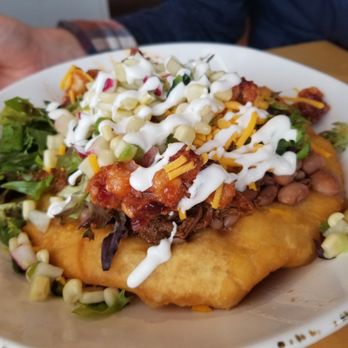 Tocabe An American Indian Eatery - Shredded bison with Indian nan topped with homny and sweet corn. - American Near Me - Denver, Colorado Tocabe An American Indian Eatery - Shredded bison with Indian nan topped with homny and sweet corn. - American Near Me - Denver, Colorado