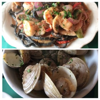 The Daily Catch - Squid ink pasta putenesca with shrimp and scallop and steamed little necks. - Italian Near Me - Boston, Massachusetts The Daily Catch - Squid ink pasta putenesca with shrimp and scallop and steamed little necks. - Italian Near Me - Boston, Massachusetts