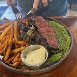 Hanger Steak Frites The Butcher Cut Cast Iron Charred , Chimichurri , House Cut Fries Roasted Mushrooms Garlic Confit Aioli