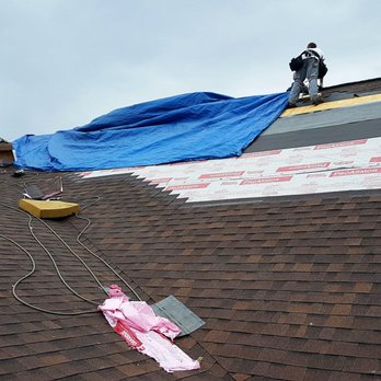 Premier Roofing And Renovations - workers working on a roof - Roofing Near Me - Fraser, Michigan Premier Roofing And Renovations - workers working on a roof - Roofing Near Me - Fraser, Michigan