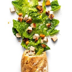 Bread Zeppelin - Classic Caesar Zeppelins. Shown with Chicken. Salad Stuffed Baguettes.