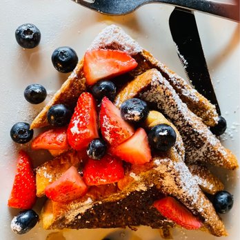 Urban American Kitchen - a plate of french toast with strawberries and blueberries - Breakfast & Brunch Near Me - Houston, Texas Urban American Kitchen - a plate of french toast with strawberries and blueberries - Breakfast & Brunch Near Me - Houston, Texas