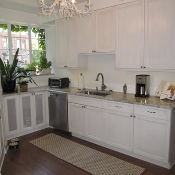 Amenities Home Design - Crisp white cabinets enlarge a triangular kitchen. - Interior Design Near Me - Chicago, Illinois Amenities Home Design - Crisp white cabinets enlarge a triangular kitchen. - Interior Design Near Me - Chicago, Illinois