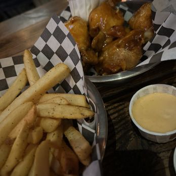 Dark Horse Tavern - 6-count mango habanero wings and half order of fries - New American Near Me - Los Angeles, California Dark Horse Tavern - 6-count mango habanero wings and half order of fries - New American Near Me - Los Angeles, California
