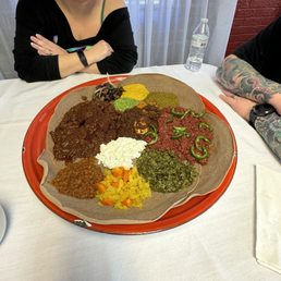 Combo (veg meat) platter, also Kitfo , Key Wat we added onto the combo Combo (veg meat) platter, also Kitfo , Key Wat we added onto the combo