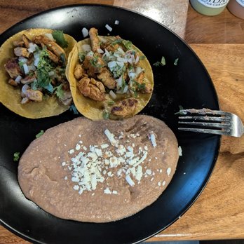 Frida’s Mexican Cantina - Two Chicken Tacos with Refried Beans. - Mexican Near Me - Charlotte, North Carolina Frida’s Mexican Cantina - Two Chicken Tacos with Refried Beans. - Mexican Near Me - Charlotte, North Carolina