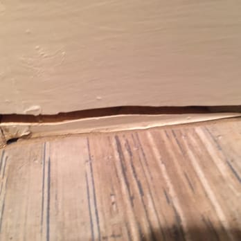 Mike's Floorcovering - Gash in baseboard. - Carpet Installation Near Me - Marble Falls, Texas