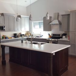 American Contracting Enterprise - Full kitchen remodel with 2 tone color and white quartz for countertops.