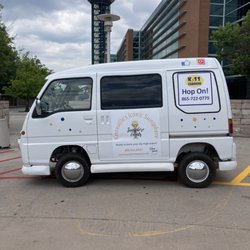 KISS Caboose - Micro-van in front of the iconic Sunsphere.