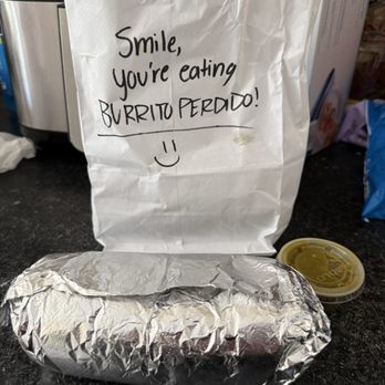 Burrito Perdido - Carne asada burrito with a side of salsa verde - Mexican Near Me - Chesapeake, Virginia