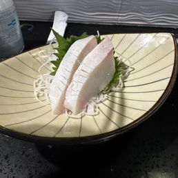 2 of the 3 pieces of Hamachi Belly Sashimi 2 of the 3 pieces of Hamachi Belly Sashimi