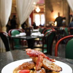 Muriel's Jackson Square - Bananas Foster Pain Perdu: Gendusa bakery French bread, apple wood smoked bacon, fresh berries, bana-rum sauce