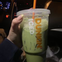 a person holding a drink a person holding a drink