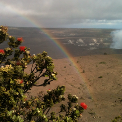 Akamai Adventure Tours & Travel - Rainbow inside the Kilauea Summit with Hale Amau'mau erupting in the upper right corner of picture. Taken by Tyler Ford inside the HVNP