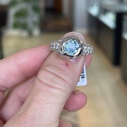 GEM Jewelers - Bezel set, 2 ct. Montana Sapphire with six side diamonds in vintage white gold setting