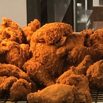 Popeyes Louisiana Kitchen - A stack of spicy Chicken on the cooling racks for customers - Fast Food Near Me - Markham, Ontario Popeyes Louisiana Kitchen - A stack of spicy Chicken on the cooling racks for customers - Fast Food Near Me - Markham, Ontario