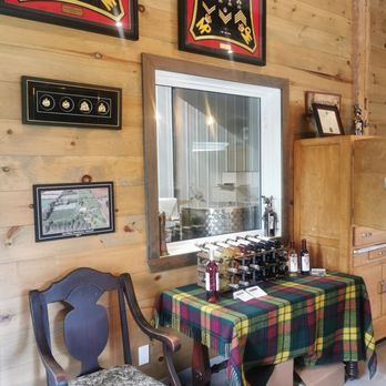 Stonehouse Vineyard - a table and chairs in the tasting room - Wineries Near Me - Lochiel, Ontario