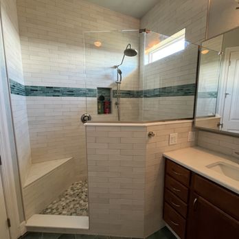 Mann Tile - Bath Remodel in Placida. We added light to the bath by lowering the wall, re-tiling, and adding glass. - Tiling Near Me - Englewood, Florida Mann Tile - Bath Remodel in Placida. We added light to the bath by lowering the wall, re-tiling, and adding glass. - Tiling Near Me - Englewood, Florida